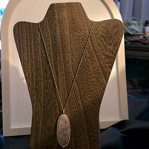 32 inch gold tone necklace with faux stone pendant.